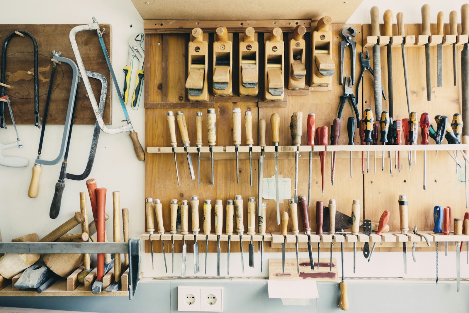 Hand tools organized on a rack, ready for a home repair job.