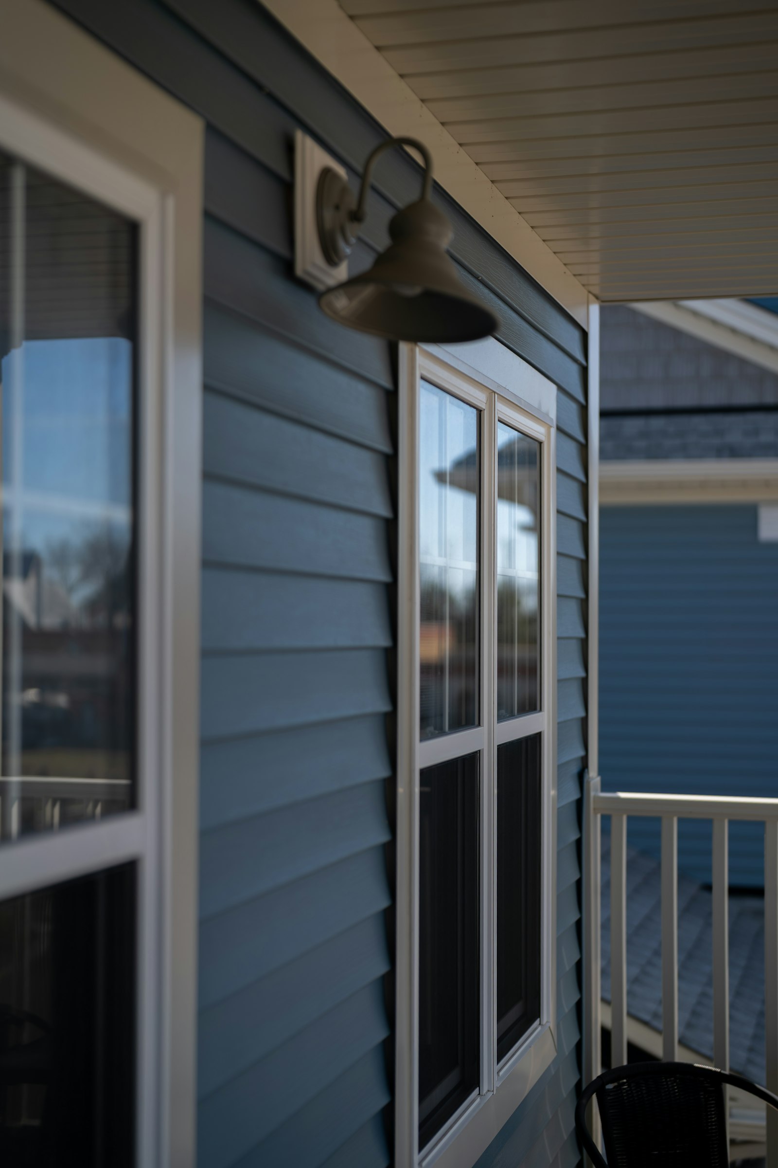 Renovated home with fresh siding and white trim.